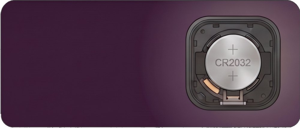 The tracker opened to show its CR2032 coin cell